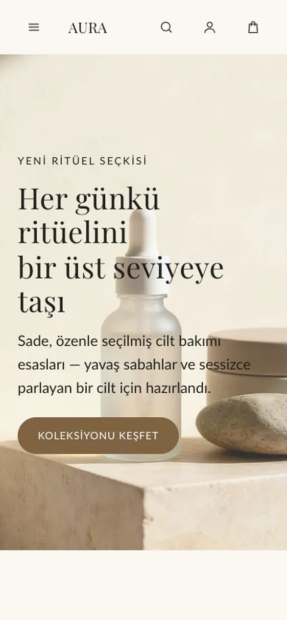 AURA temasının ana sayfası: krem zeminde cilt bakımı hero'su, sekiz ürünlük Cilt Bakımı Seçkisi, kayan değerler şeridi ve Felsefemiz bölümü.